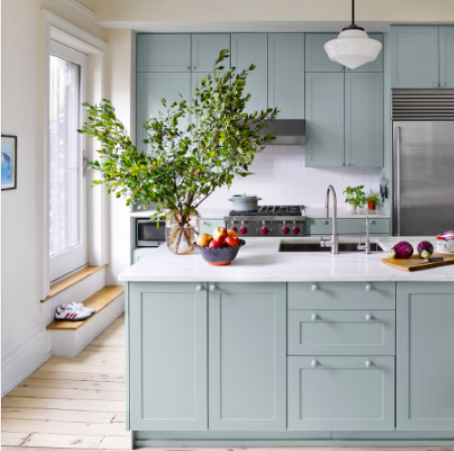 kitchen with blue cabinets and a white countertop