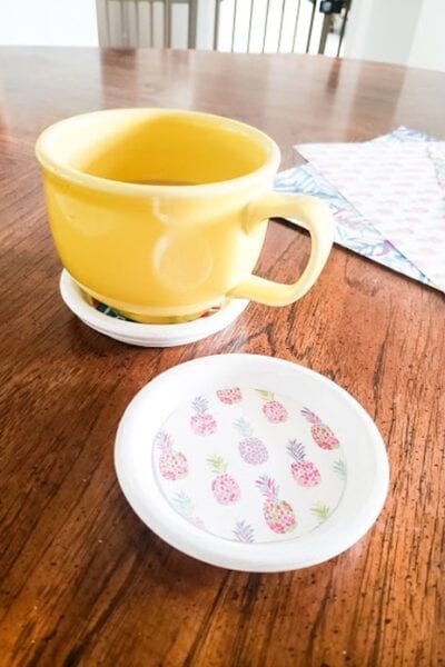 A yellow coffee cup on a white coaster how to make adorable spring coasters