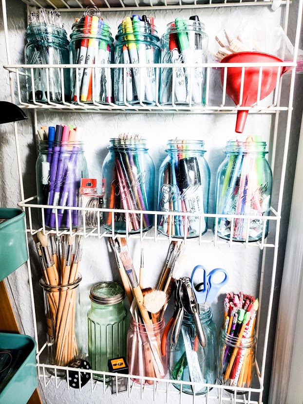 Paint-Brushes-and-Pencils-in-Canning-Jars-Organized-on-Wire-Rack-Shelving