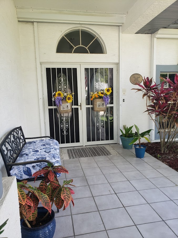 Front porch with beautiful bench cushion cover