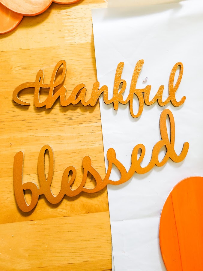 Wooded cut out words "blessed" and "thankful"