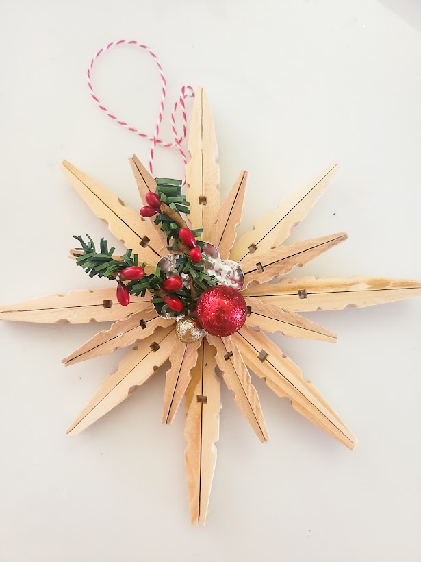 Double clothespin star ornament with berry embellishments