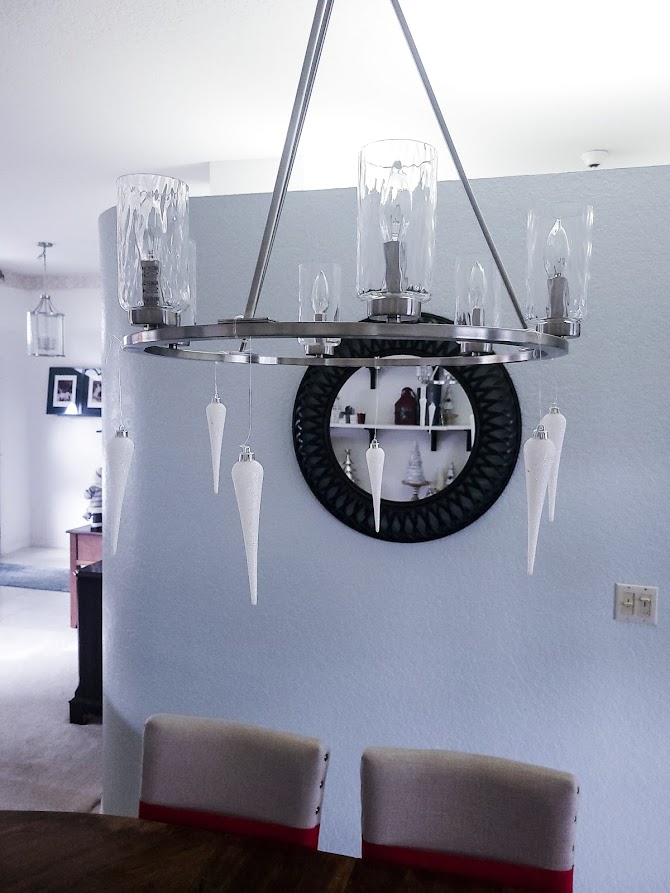 A picture of the glass icicles tied evenly around the frame of the chandelier