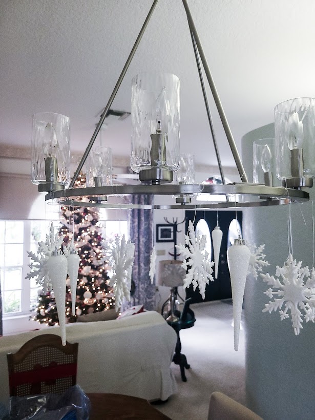 A picture of my Christmas chandelier with icicles and white snowflakes