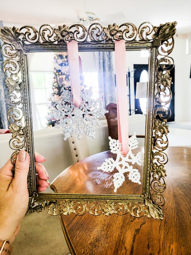 The frame with both snowflakes tied to it.