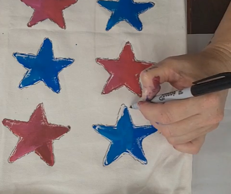 white pillow with red and blue stars