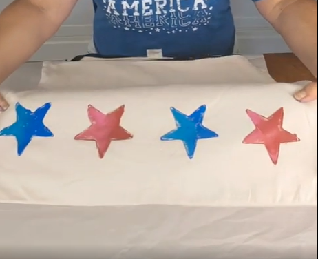 white pillow with red and blue stars