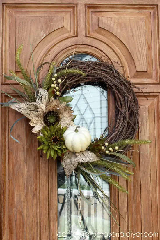 pumpkin wreath on wooden front door