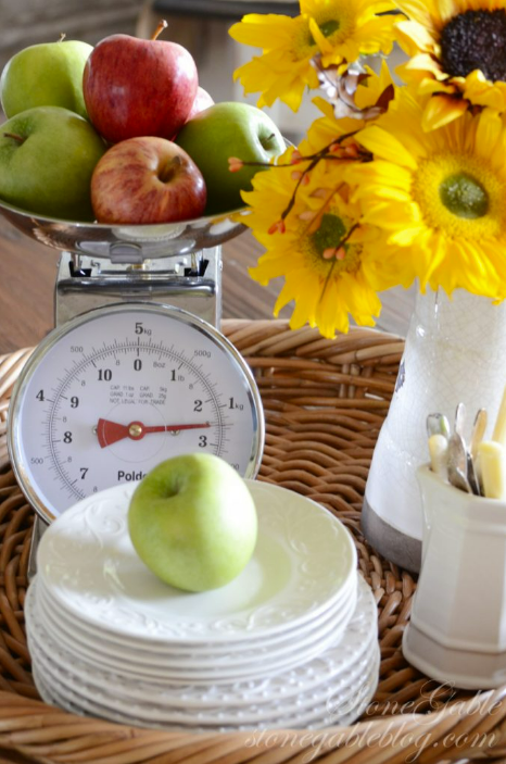 green apple on a plate with a food scale