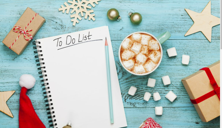 to do list tablet and a cup of hot cocoa with marshmallows