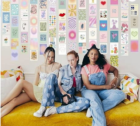 3 girls sitting on a bed in a dorm room