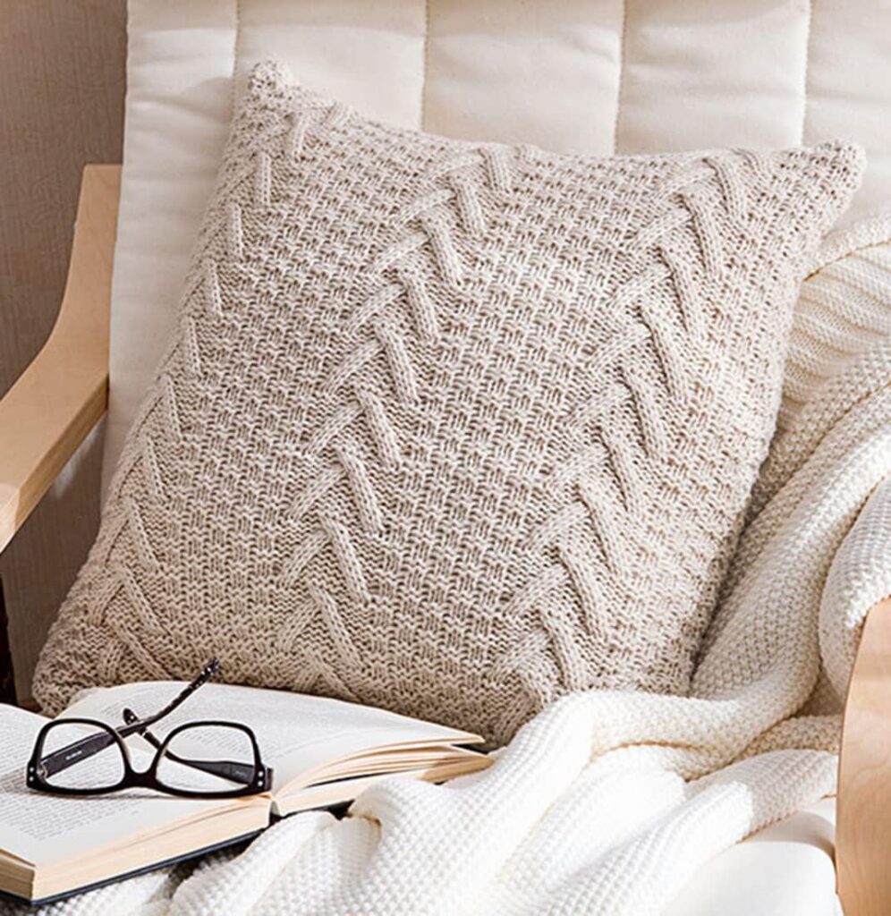 white cable knitted pillow