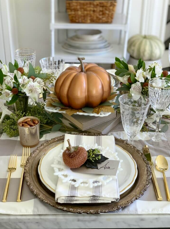 pumpkin tablescape with white china
