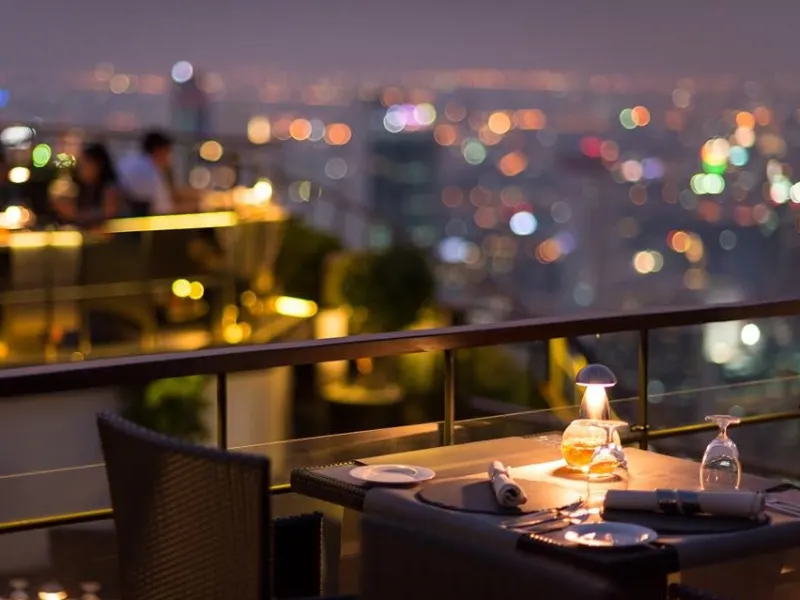 dining table on a rooftop at night