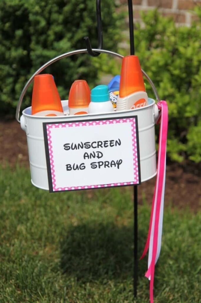 sunscreen and bug spray set up for outdoor party