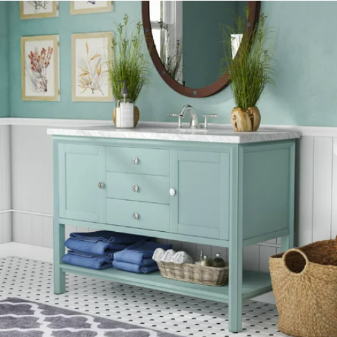 bathroom vanity in mint green with matching paint on walls