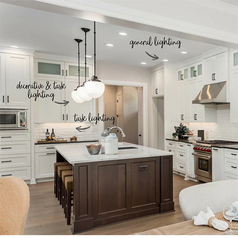 white kitchen with large stained island and pendant lighting