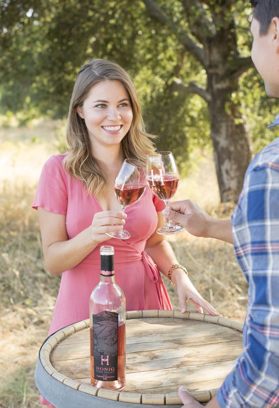 man and woman enjoying a glass of wine