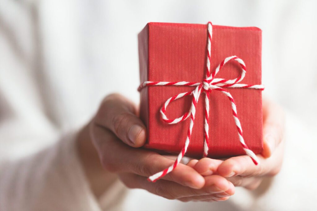 woman holding a small wrapped present