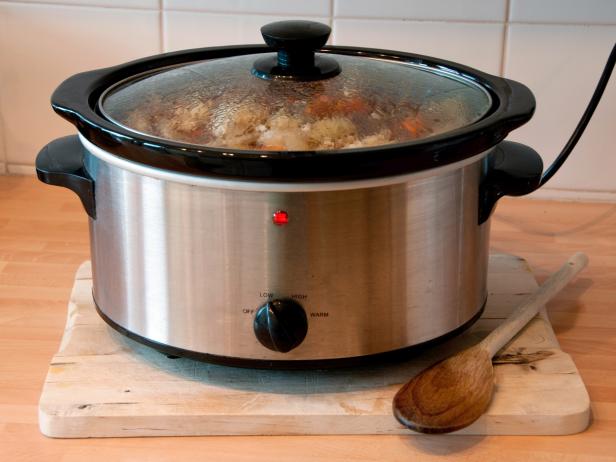 Slow cooker with wooden spoon