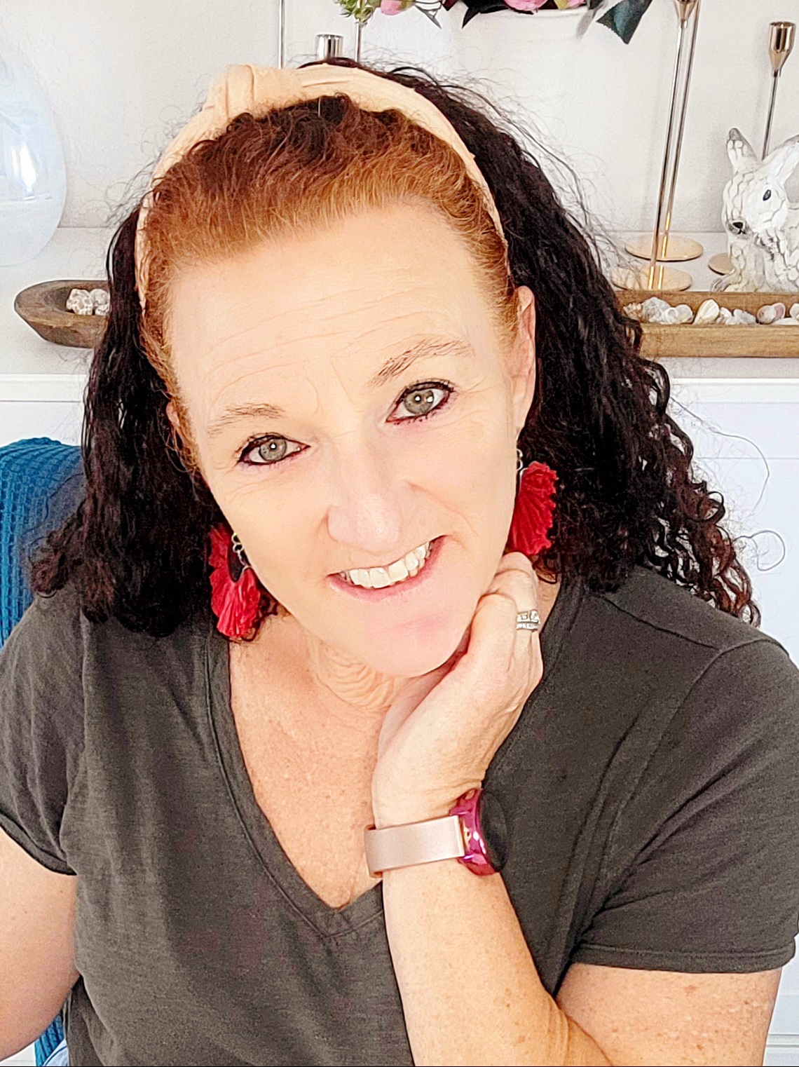 woman close up with red earrings