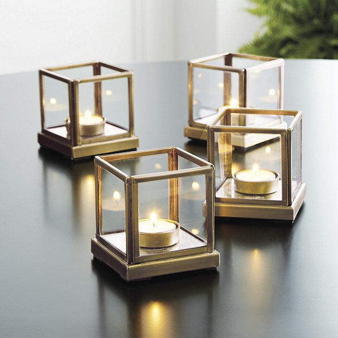 metallic candle holders on a table