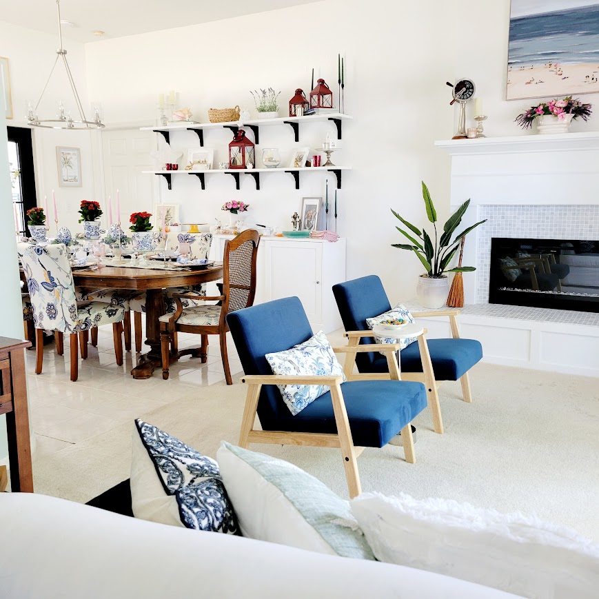 white living room with blue chairs and a fireplace my Easter home tour