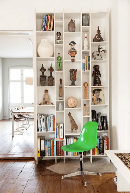 large bookshelf with travel souvenirs displayed timeless tips for a stylish space