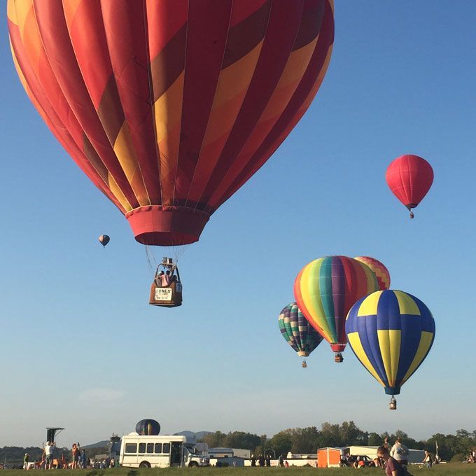 a bunch of hot air balloons in the air