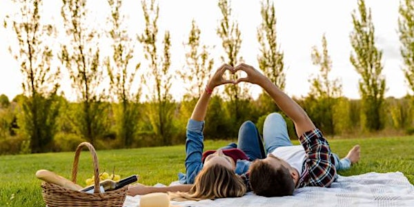 a couple laying on a blanket in the grass the best spring dare ideas