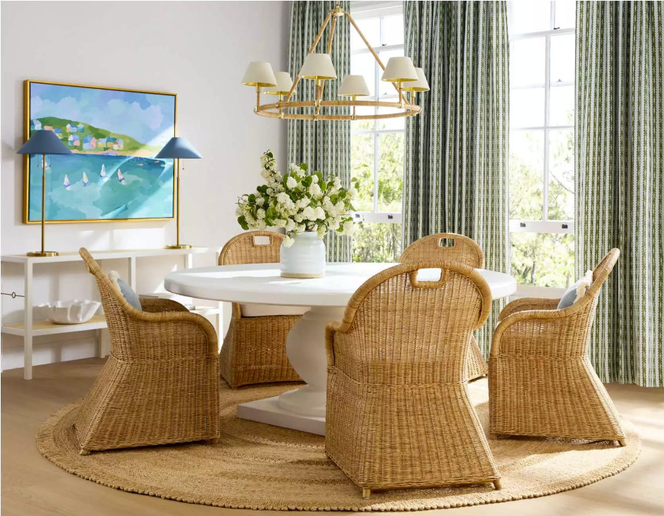 dining room with wicker chairs and a pedestal table