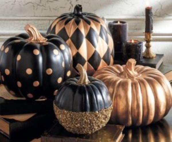 4 black and gold pumpkins painted in diamond and polka dot patterns upscale halloween home decor