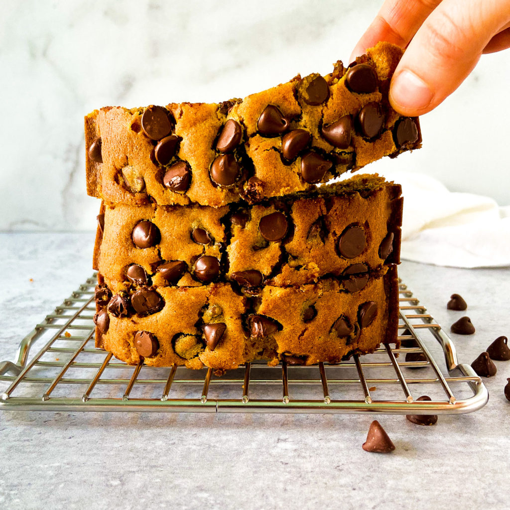 3 slices of chocolate chip pumpkin bread stacked on top of each other on a cooling rack fabulous fall desserts