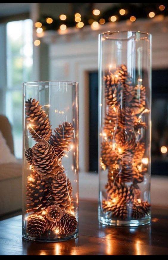 2 glass cylinders filled with pinecones and fairy lights create a stunning Christmas arrangement in 3 simple steps