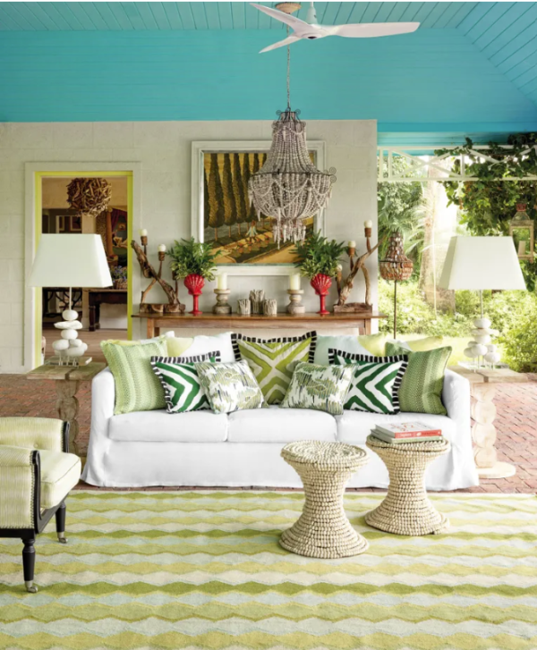 a living room with brightly colored pillows and accessories