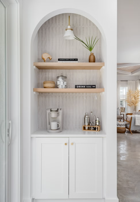 white coffee bar with arched opening and open shelving how to set up the perfect coffee bar at home