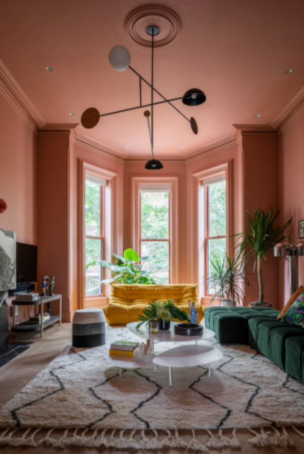 salmon living room walls and ceiling with mauve trim and drapes embrace the art of cozy decorating