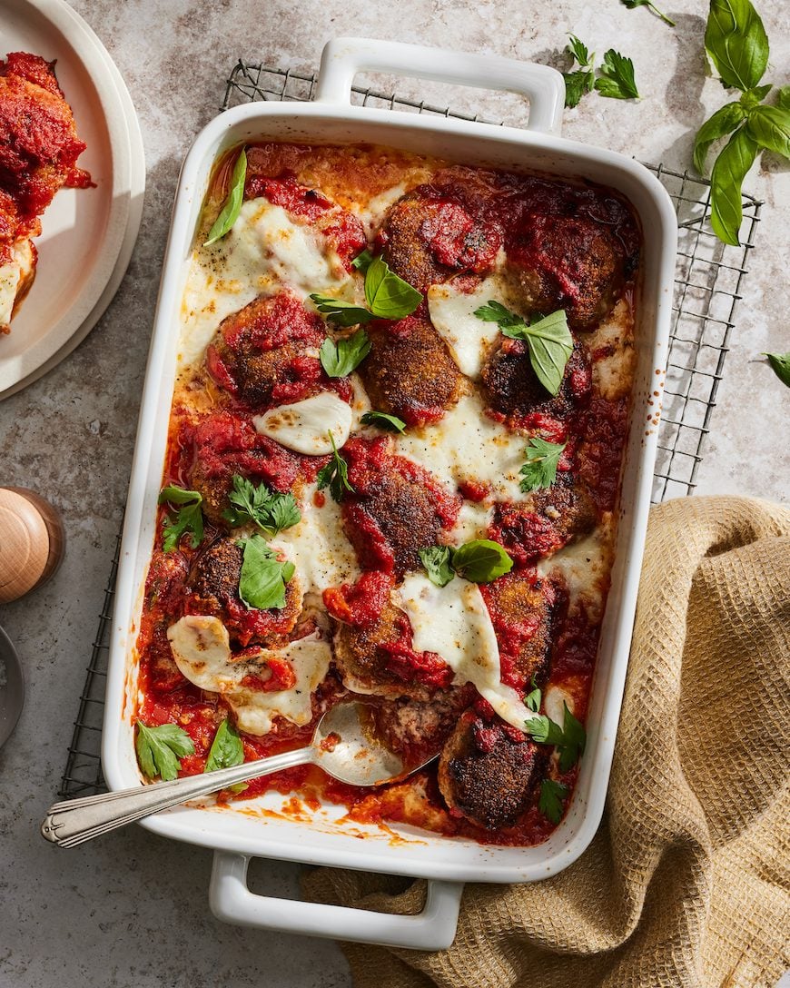 a casserole dish of Italian meatballs on a table