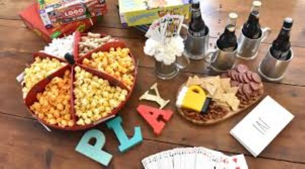 drinks and snacks on a table for game night