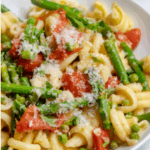 a bowl of spring pasta salad with asparagus spring family dinners