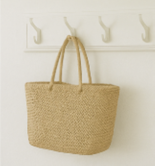 A rattan basket with handles hanging on a wall hook how to add a relaxing summertime vibe to your home
