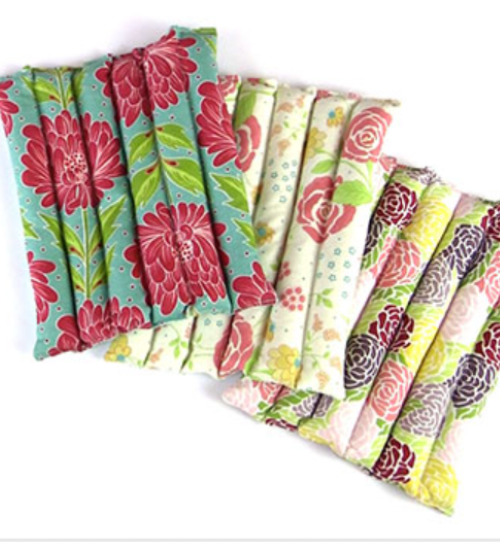 a set of 3 hot packs made with colorful fabrics