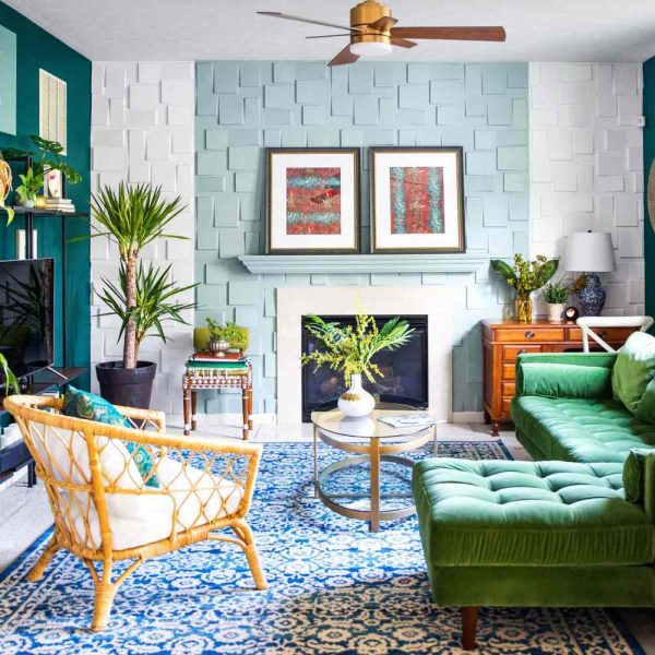 living room with tturquoise fireplace, green sofa and a blue rug DIY extends beyond arts and crafts