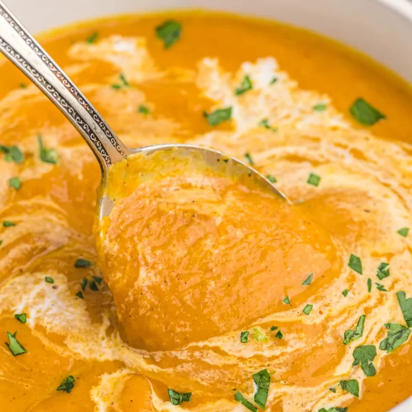 bowl of pumpkin soup with a spoon