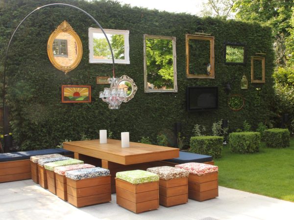 a patio with wall art on a large living wall