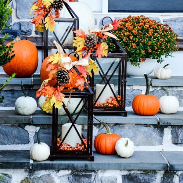 steps with small pumpkins and lanterns