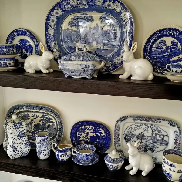 Blue transferware dishes on a shelf