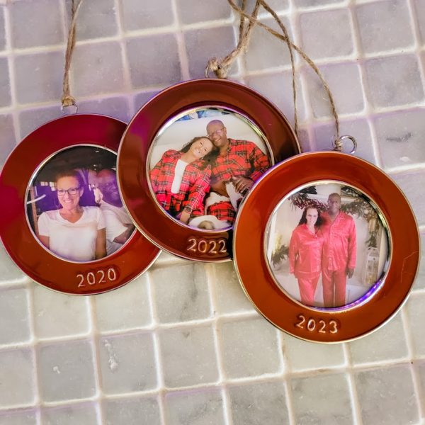 3 red round picture frames with photos