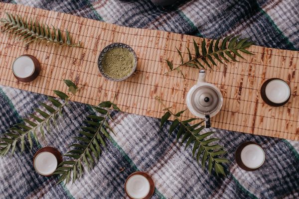 overhead view of a teapot and bowl on a blanket finding peace in God's creation