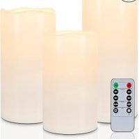 three battery-operated candles with remote decorate for fall when it feels like summer